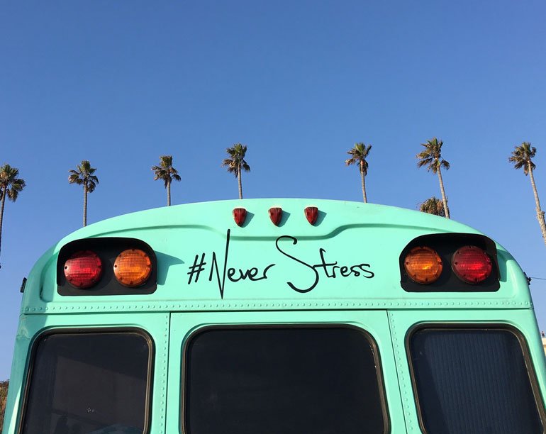 School bus with "#NeverStress" written on back